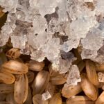 a close up of a pile of nuts and ice
